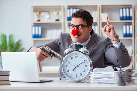 Clown businessman working in the office angry frustrated with aの写真素材
