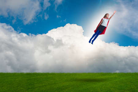 Superhero kid flying in dream conceptの写真素材