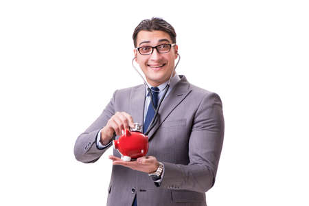 Businessman with stethoscope and piggybank isolated white backgrの写真素材