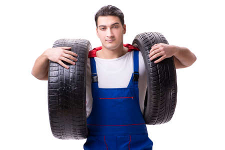 Superhero man with tyre isolated white backgroundの写真素材