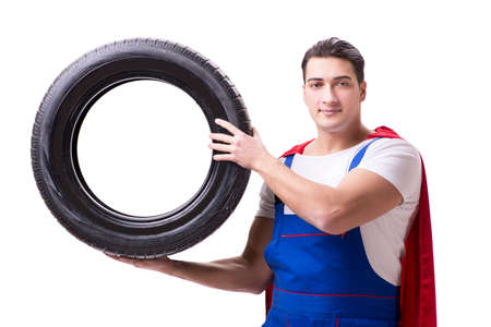 Superhero man with tyre isolated white backgroundの写真素材