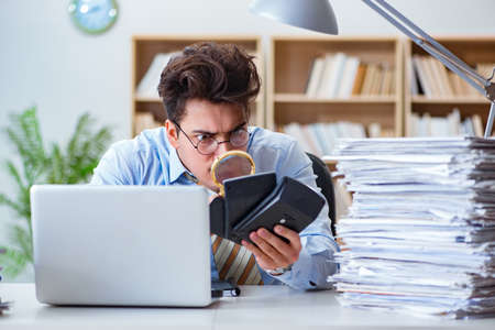 Mad auditor looking for errors in the reportの写真素材