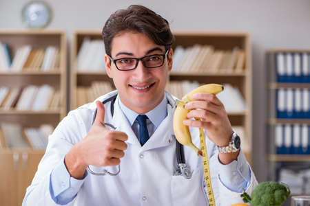Scientist studying nutrition in various foodの写真素材