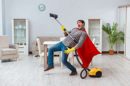 Super hero cleaner working at homeの写真素材