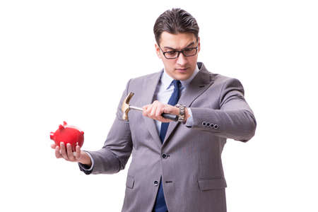 Businessman breaking piggybank isolated white backgroundの写真素材