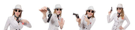 Beautiful girl holding hand gun isolated on whiteの写真素材