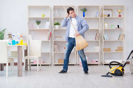 Man doing cleaning at homeの写真素材