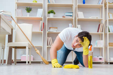 Man doing cleaning at homeの写真素材