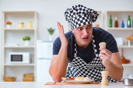 Chef cook cooking a meal breakfast dinner in the kitchenの写真素材