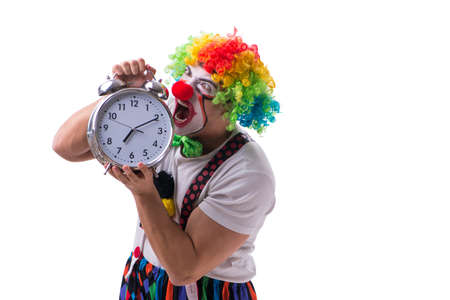 Funny clown with an alarm clock isolated on white backgroundの写真素材