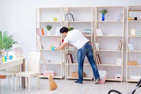 Man doing cleaning at homeの写真素材