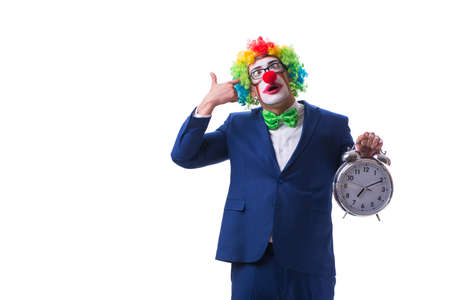 Funny clown businessman with an alarm clock isolated on white baの写真素材