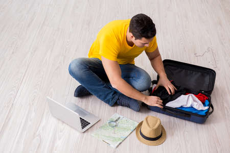 Man planning his vacation trip with mapの写真素材