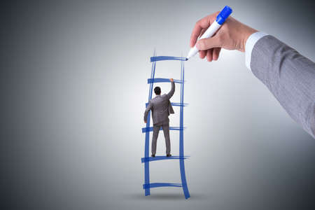 Businessman climbing career ladder in business conceptの写真素材