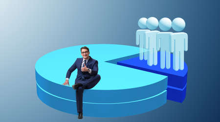 Businessman sitting on pie chart in business conceptの写真素材