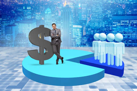 Businessman standing on pie chart in business conceptの写真素材
