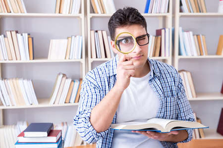 Young student with books preparing for examsの写真素材