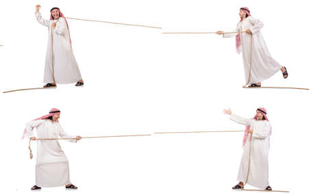 Arab in tug of war concept on whiteの写真素材