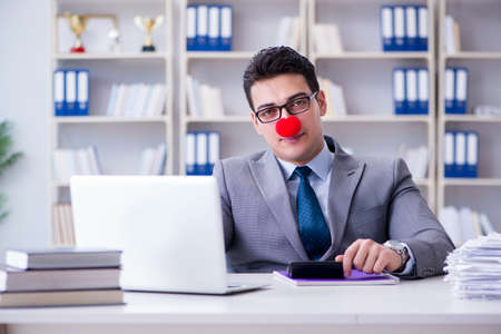 Clown businessman in the officeの写真素材