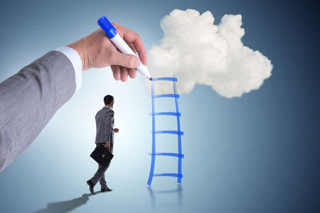 Businessman climbing career ladder in business conceptの写真素材
