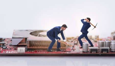 Cryptocurrency concept with businessman mining moneyの写真素材