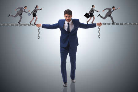 Businessman providing help to colleaguesの写真素材