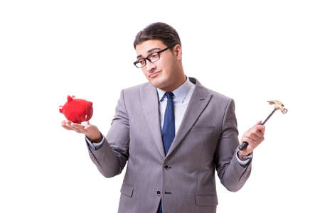 Businessman breaking piggybank isolated white backgroundの写真素材