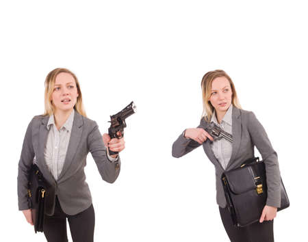 Businesswoman with gun isolated on whiteの写真素材
