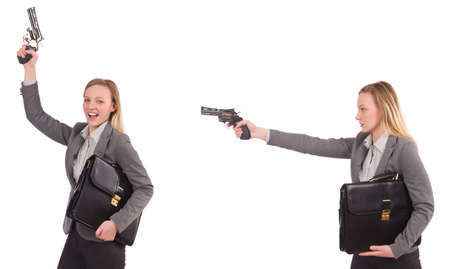 Businesswoman with gun isolated on whiteの写真素材