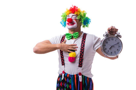 Funny clown with an alarm clock isolated on white backgroundの写真素材