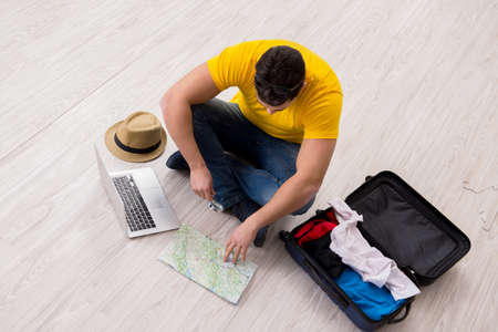Man planning his vacation trip with mapの写真素材