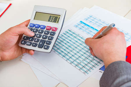 Finance analyst looking and financial reports