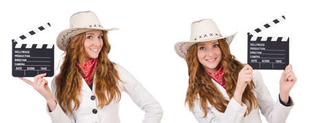 Young   cowgirl  with movie board isolated on whiteの写真素材