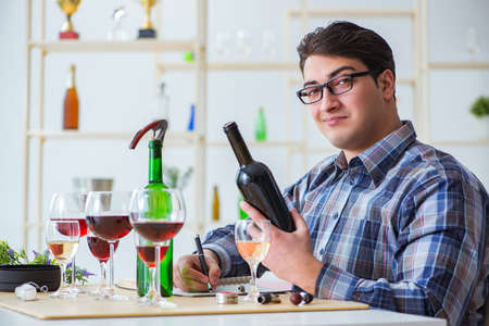 Professional sommelier tasting red wineの写真素材