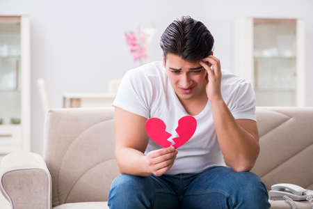 Young man in sad saint valentine conceptの写真素材