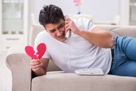 Young man in sad saint valentine conceptの写真素材