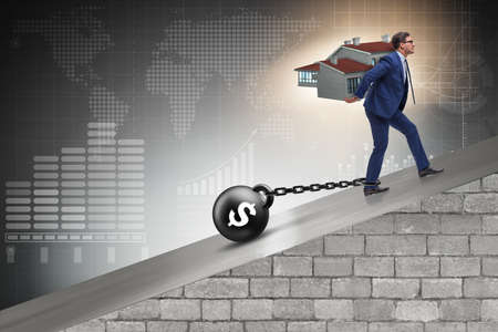 Businessman in mortgage debt financing conceptの写真素材