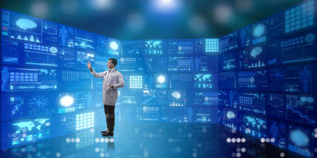 Doctor in telemedicine concept pressing buttons