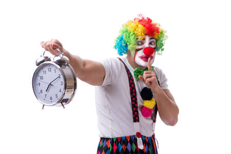 Funny clown with an alarm clock isolated on white backgroundの写真素材
