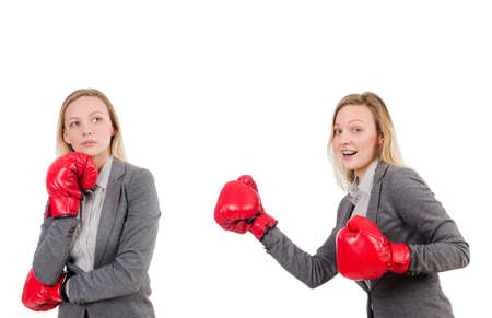 Woman businesswoman with boxing gloves on whiteの写真素材