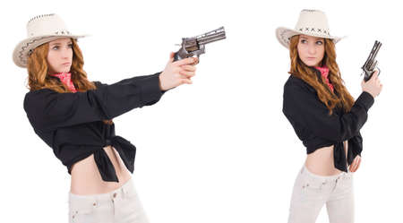 Young cowgirl with handgun isolated on whiteの写真素材