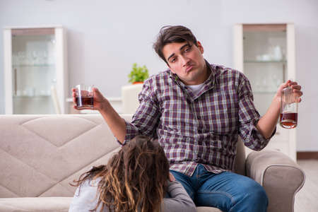 Drinking problem drunk husband man in a young family conceptの写真素材