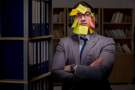 Businessman struggling with conflicting priorities during long hの写真素材