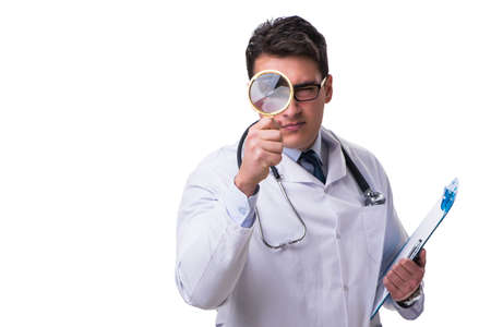 Young male doctor with a looking magnifying glass isolated on white backgroundの写真素材