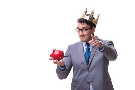 King businessman holding a piggy bank isolated on white backgrouの写真素材