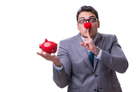 Funny clown businessman with a piggy bank isolated on white backの写真素材