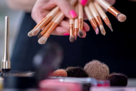 Collection of make up products displayed on the tableの写真素材