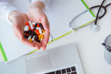 Medical concept with medicines and laptop computerの写真素材