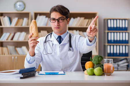 Scientist studying nutrition in various foodの写真素材