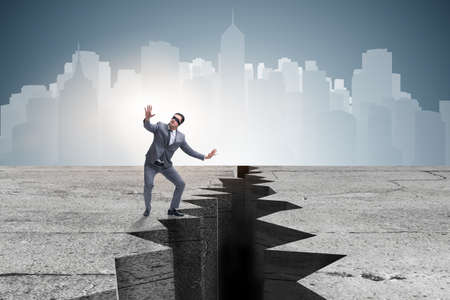 Blindfolded businessman in uncertainty conceptの写真素材